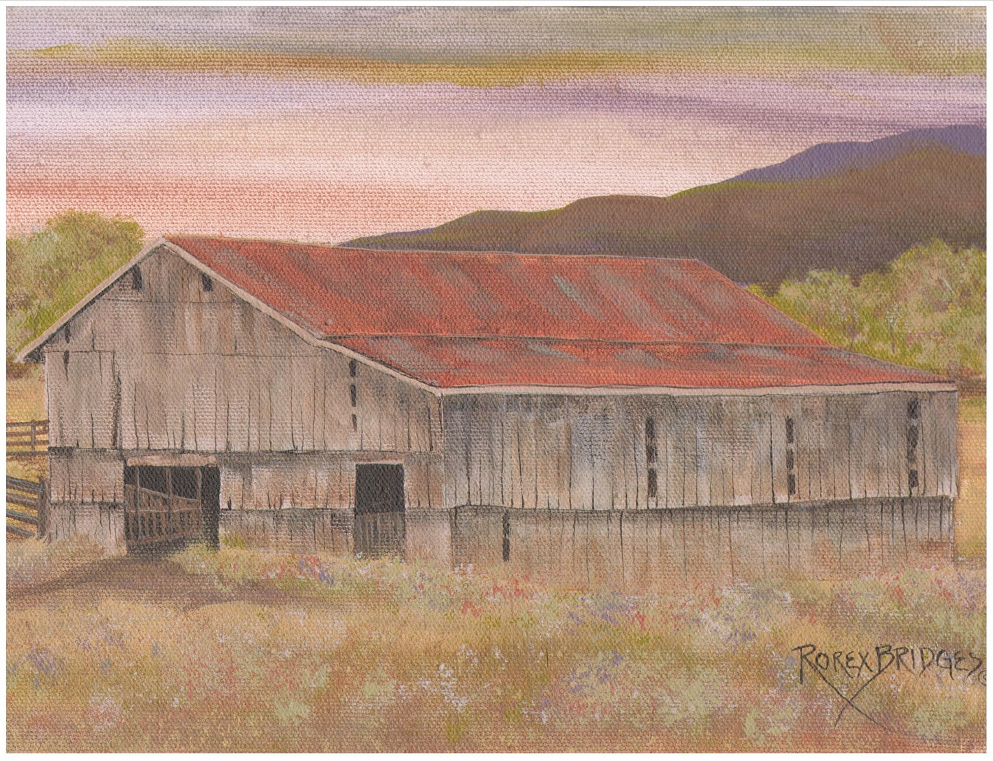 WEATHERED WOOD BARN WITH RED ROOF IN A VALLEY